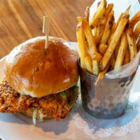 Nashville Hot Chicken · Fried chicken breast, slaw, pickles, smoked chili oil, French fries.