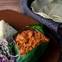 Cochinita Pibil · Our chef Alex recommends. Slow-roasted pork cooked in banana leaf, Yucatan-style, pickled re...
