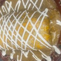 Burrito Texano · Flour tortilla filled with meat of your choice, refried beans, rice, Monterey Jack cheese, t...