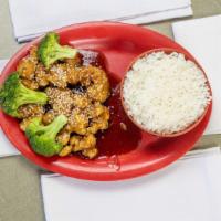 Sesame Chicken · Fried and sauteed in brown sauce with broccoli sesame seeds on top