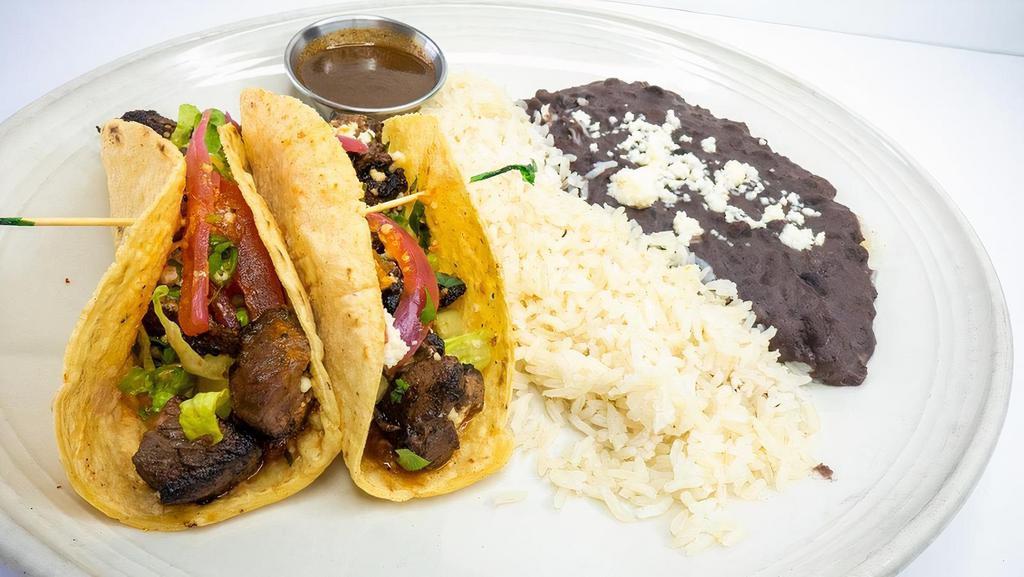 Carnitas Tacos · pork carnitas, pickled red onions, chile de arbol salsa, queso fresco, cilantro, housemade soft white corn torillas, white rice, black beans 2 tacos per order served with habanero sauce on the side