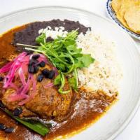 Cochinita Pibil · yucatan-style braised pork, tangy orange, achiote sauce, whire rice, black beans, pickled re...