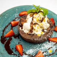 Pastel De Chocolate · moist oaxacan dark chocolate cake with corn ice cream, warm chocolate rum sauce