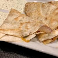 Quesadillas · Fajita beef or chicken with onion, poblano peppers, cheddar, & pepper-jack with a side of pi...