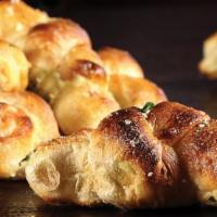 Truffle Garlic Knots* · Hand-knotted pizza dough tossed with truffle olive oil, fresh garlic, and Pecorino Romano ch...