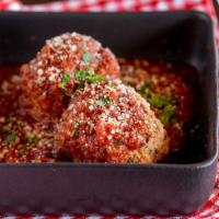 Russo’S Homemade Meatballs · Two large homemade Italian meatballs served with Russo’s Bolognese meat sauce.