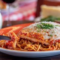 Chicken Parmesan · Tender chicken breast seasoned with Italian breadcrumbs, topped with Russo’s homemade marina...