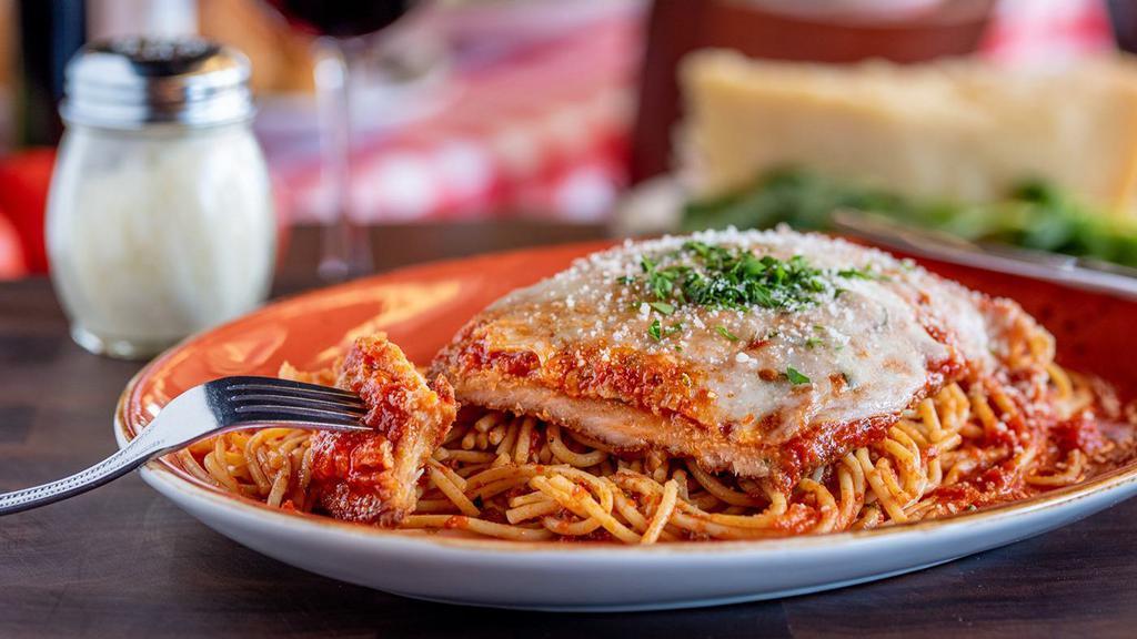 Chicken Parmesan · Tender chicken breast seasoned with Italian breadcrumbs, topped with Russo’s homemade marinara sauce and Wisconsin mozzarella, served with fresh spaghetti pasta.