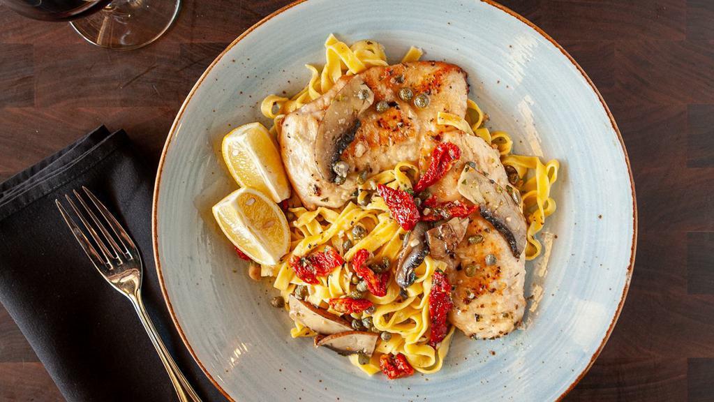 Chicken Piccata · Grilled chicken, Portabella mushrooms, capers, sun-dried tomatoes, and fettuccine pasta, in a lemony garlic sauce.