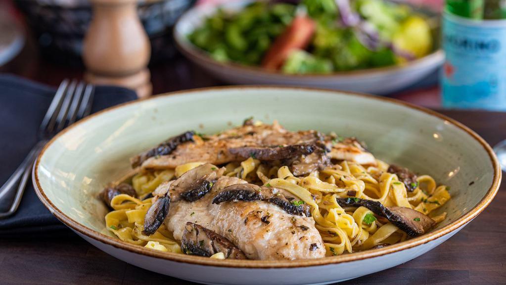 Chicken Marsala · Chicken breast sautéed with Portabella mushrooms, simmered in a decadent floral Marsala wine sauce, served with fettuccine.
