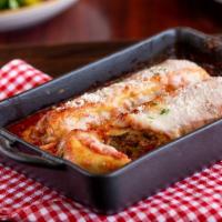 Chicken Manicotti · Fresh pasta stuffed with chicken, kale, and spinach, topped with Russo’s marinara and mozzar...