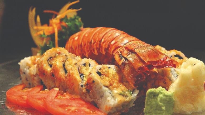 Lobster Roll · Fried lobster, crab meat, cucumber, avocado, topped with masago, eel sauce, spicy mayo and white mayo
