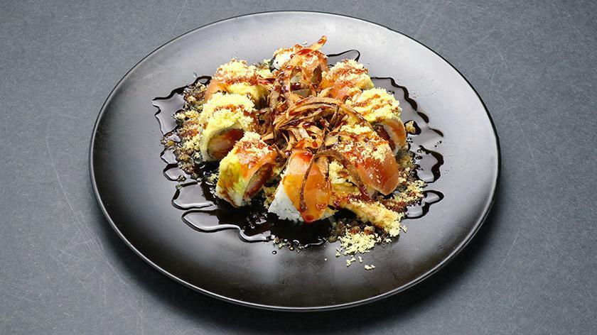 Ninja Roll · Fried shrimp, spicy tuna, cucumber topped with albacore tuna, fried onions, tempura flakes, ponzu and eel sauce