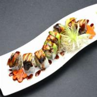 Dragon Roll · Crab meat, avocado, cucumber with eel, avocado, eel sauce on top