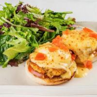 Crab Cake Benedict · Two poached eggs with grilled lump crab cakes and tomato piled high on an English muffin, to...