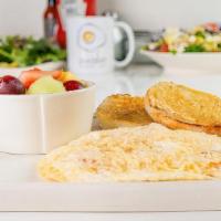 Mediterranean Frittata · An open-faced, egg white omelet filled with all-natural  chicken, house-roasted tomatoes, mo...