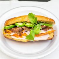 Bánh Mì · Vietnamese sandwich with grilled pork. 
(bread, butter, grilled pork, cucumber, cilantro, ja...
