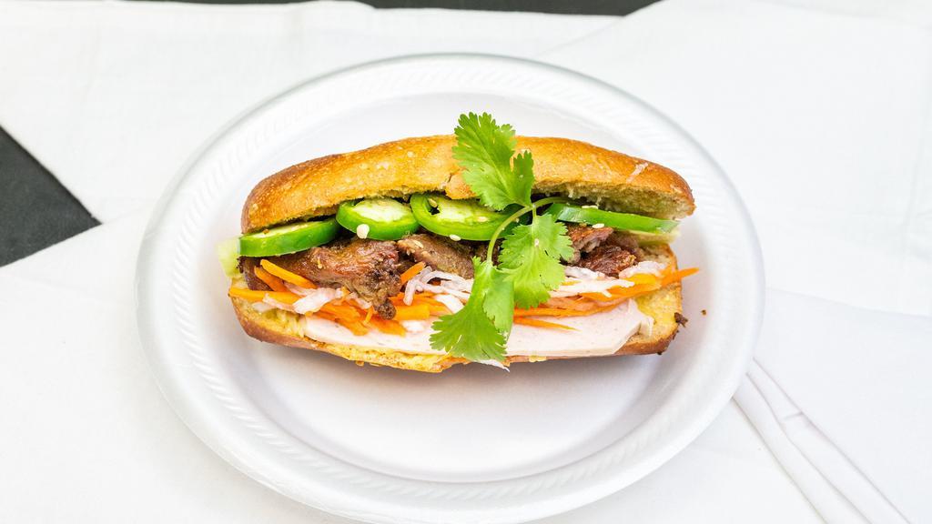 Bánh Mì · Vietnamese sandwich with grilled pork. 
(bread, butter, grilled pork, cucumber, cilantro, jalapenos, pickle carrot