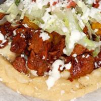 Sopes · Frijoles, queso, lechuga, tomate, aguacate queso fresco, crema. / beans, cheese, lettuce, to...