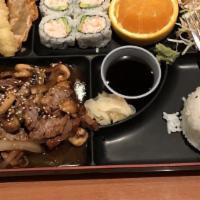 Beef Teriyaki Bento Box · Served with miso soup, salad, steamed rice, four pieces California roll, shrimp, veggie temp...