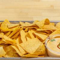 Chips & Queso · 8 oz. homemade queso served with our fresh, homemade chips! We fry a fresh batch of chips fo...