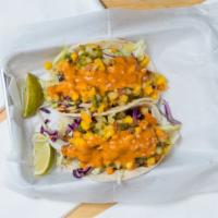 Fish Taco · 1 deep fried catfish taco, topped with mango salsa, red cabbage, pico and chipotle sauce.