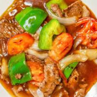 Pepper Steak · Stir-fried beef, with bell peppers, tomatoes, and onions.