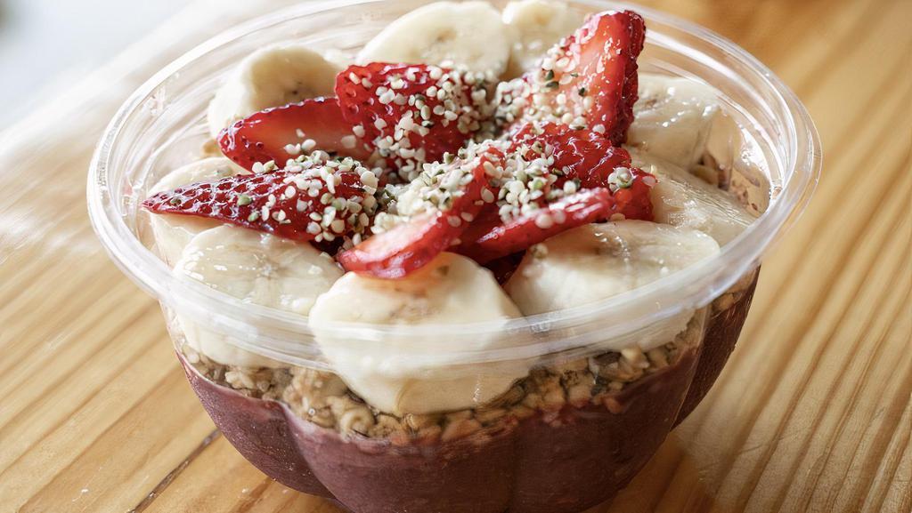 Acai Bowl · apple juice, strawberry, acai topped with gluten-free granola, coconut oil, strawberries, sliced banana, hemp seeds