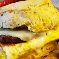 Lone Ranger · Local eggs, country sausage patty, pepperjack cheese, on a jalapeno cheddar biscuit