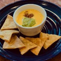 Katie'S T-Sip Dip Small · House made chile con queso topped with guacamole and taco meat.