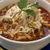Tortilla Soup · Our house made Chicken Tortilla Soup with avocado topped with tortilla strips & jack cheese.
