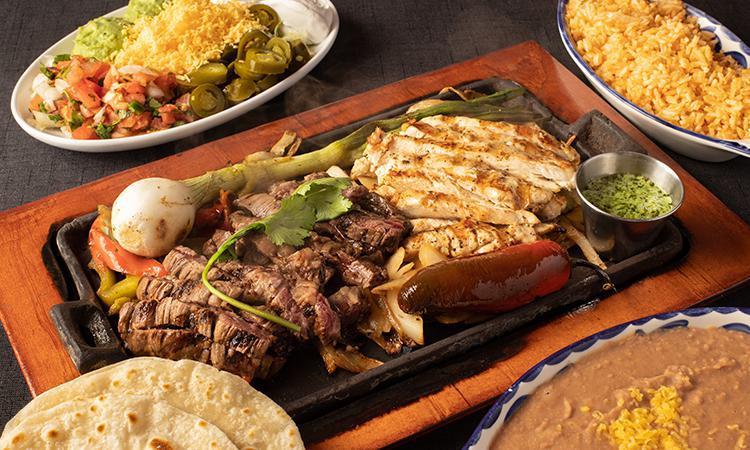 1 Lb Combo Fajitas · Our Black Angus Beef and Grilled Chicken Fajitas. Served with homemade tortillas, Mexican Rice, and Choice of Beans.