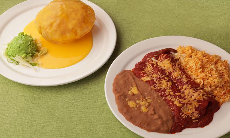 Meatless Special · Puffy Queso, Guacamole Salad, and Two Cheese Enchiladas topped with Spanish Sauce. Served with Mexican Rice and Beans.
