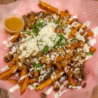 Fairytale Papas · French fries. Bistec. Drizzle with crema mexicana. Queso fresco. Grilled onions and cilantro.