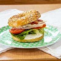 Plain Bagel Sandwich · Warm toasted Bagel with your choice of either (ham, turkey, or sausage patty) and cheese, eg...