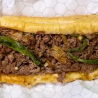 Poblano Cheesesteak  · The Poblano Cheesesteak comes with grilled onions, American swiss cheese and topped off with...