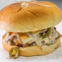 Rudy Burger · The Rudy Burger is our traditional half-pound handmade burger that comes with grilled onions...