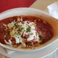 Eggplant Parmigiano · Tender baked eggplant covered with mozzarella and marinara sauce and served on a fresh baked...
