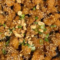 Sweet & Sour Chicken · Battered chicken in a sweet and sour sauce. Topped with peanuts. Different from the style wi...