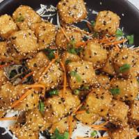 Sesame Tofu · Cubed fried and battered tofu tossed in sesame sauce.