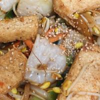 Japanese Tofu Family Style · Lightly fried tofu, stir-fried with assorted vegetables in a brown sauce.