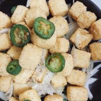 Salt & Pepper Tofu · Battered tofu tossed with jalapeños  and onions with salt and pepper.