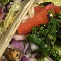 Nae'S Pretty Girl Tacos · Three tacos served with with lettuce cilantro tomato onions and cheese