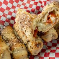 Pepperoni Rolls · Pepperoni and Real Wisconsin Mozzarella rolled in our fresh dough. Served with marinara.