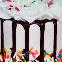 Celebration Cake · Our famous Mexican Vanilla Ice Cream layered between Moist Chocolate Cake and our Decadent H...