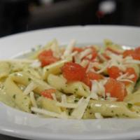 Grilled Chicken Penne Pesto · House made pesto, grilled chicken, balsamic tomatoes, Parmigiano-Reggiano.