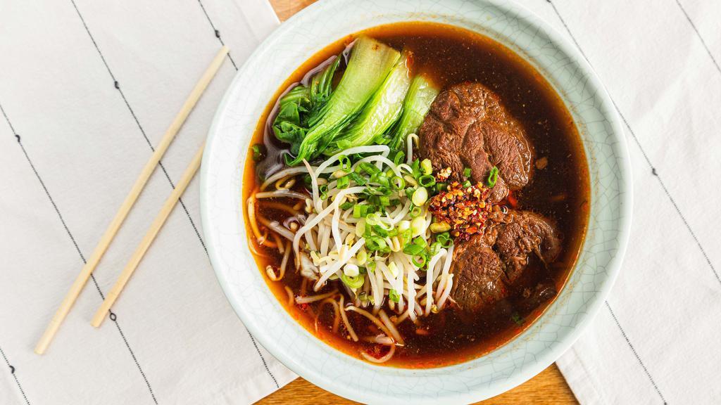 Braised Beef Soup Noodle · Slow braised beef shank with noodles in a rich, spicy broth.
Spicy