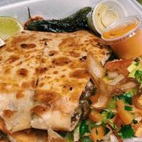 Chicken Quesadilla · A delicious jumbo flour tortilla stuffed with our juicy grilled chicken and a blend of chees...