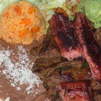 Carne Asada · A delicious cut of carne asada steak served with vegetables, rice, beans, and handmade torti...
