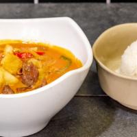 Massaman Curry · Massaman curry, coconut milk, potato, bell pepper, onion, and peanut. (with a side of rice)